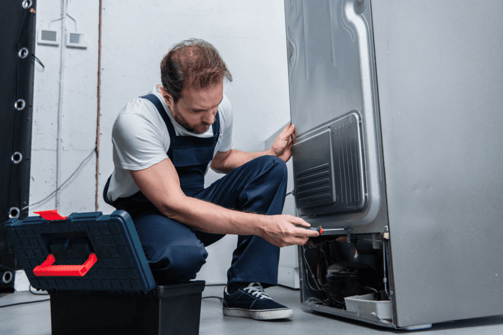 Refrigerator sealed system leak repair by certified technician